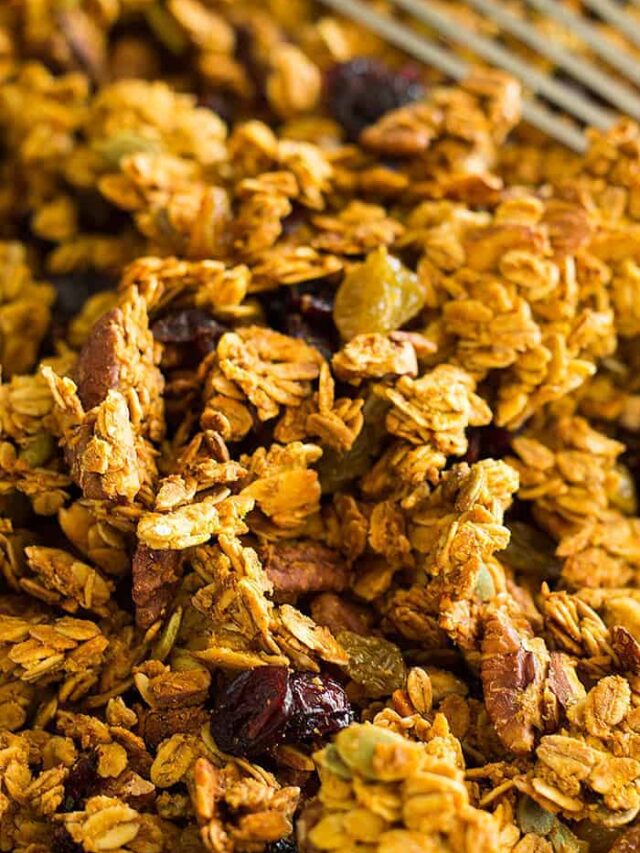 This easy and healthy Crunchy Pumpkin Granola is made with real pumpkin! It has tons of fall goodies like pecans, pumpkin spice and pumpkin seeds!