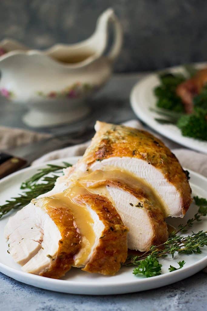 This Butterflied Roasted Herb Turkey (spatchcocked) will be the juiciest bird you've ever cooked. It cooks in half the time with crispy skin and moist meat!