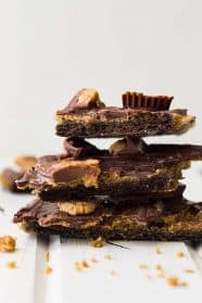 This Peanut Butter Cup Graham Cracker Toffee is crunchy, swirled with peanut butter, then topped with peanut butter cups!