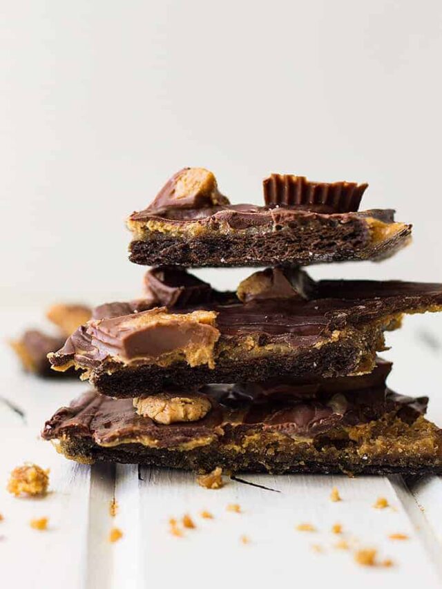 This Peanut Butter Cup Graham Cracker Toffee is crunchy, swirled with peanut butter, then topped with peanut butter cups!