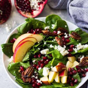 This Spinach, Apple, and Pomegranate Salad is packed with nutrition and full of crunch! Plus, it makes a beautiful salad to look at!