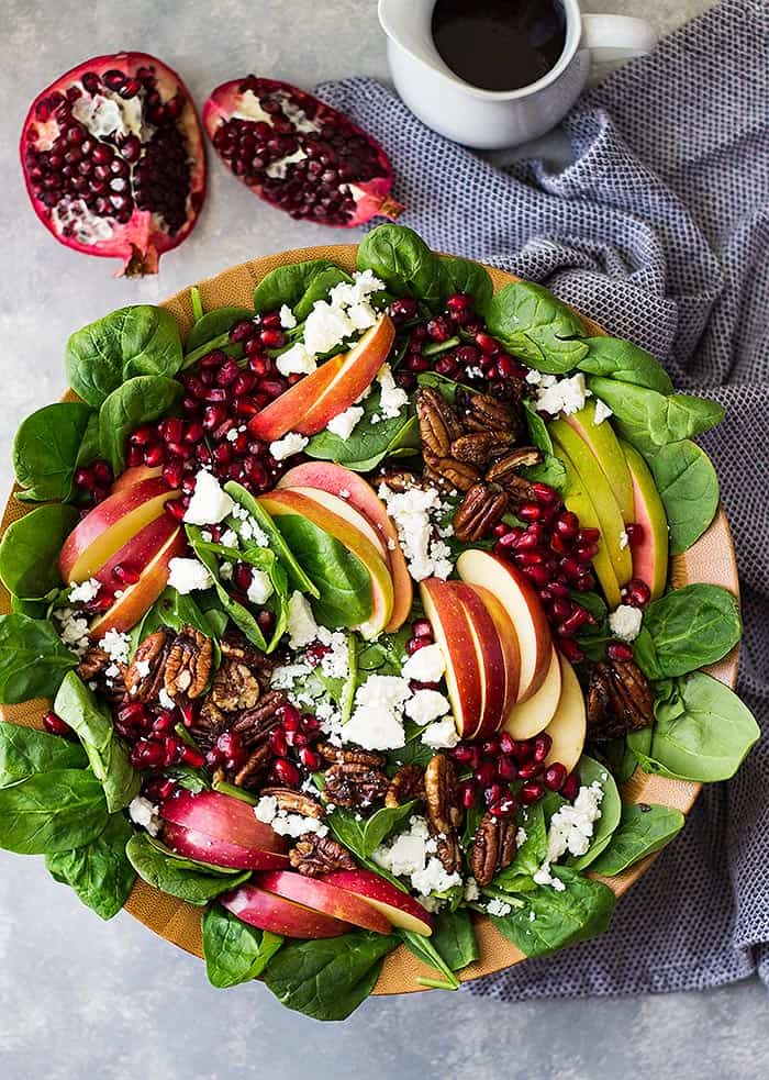 This Spinach, Apple, and Pomegranate Salad is super healthy, packed with flavor and loaded with crunch! Plus, it makes a beautiful presentation! 