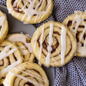 These Cinnamon Roll Cookies have all the flavor of a cinnamon roll without the yeast and rising! Complete with icing too!