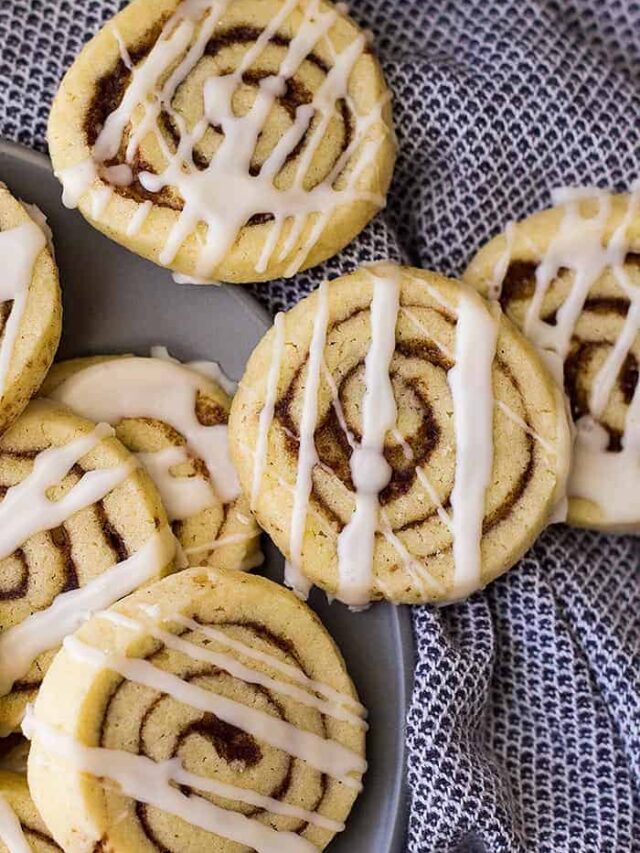 These Cinnamon Roll Cookies have all the flavor of a cinnamon roll without the yeast and rising! Complete with icing too!