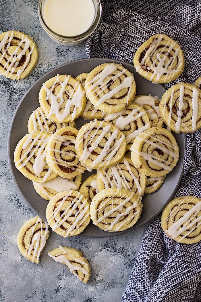 These Cinnamon Roll Cookies have all the flavor of a cinnamon roll without the yeast and rising! Complete with icing too!