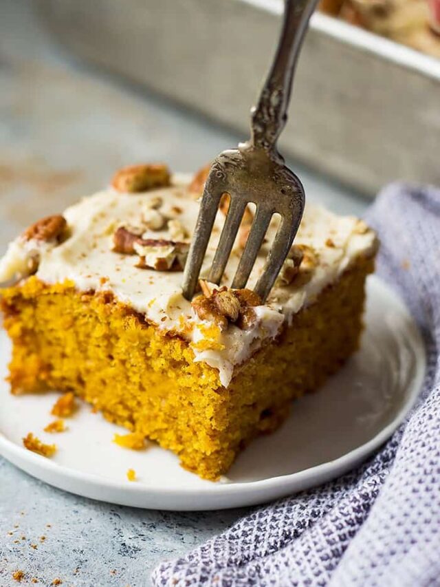 This Easy Pumpkin Cake with Cream Cheese Frosting is a lot easier than a pumpkin cake roll but tastes just like it! It's moist, full of pumpkin spice, topped with a dreamy cream cheese frosting and perfect for fall!