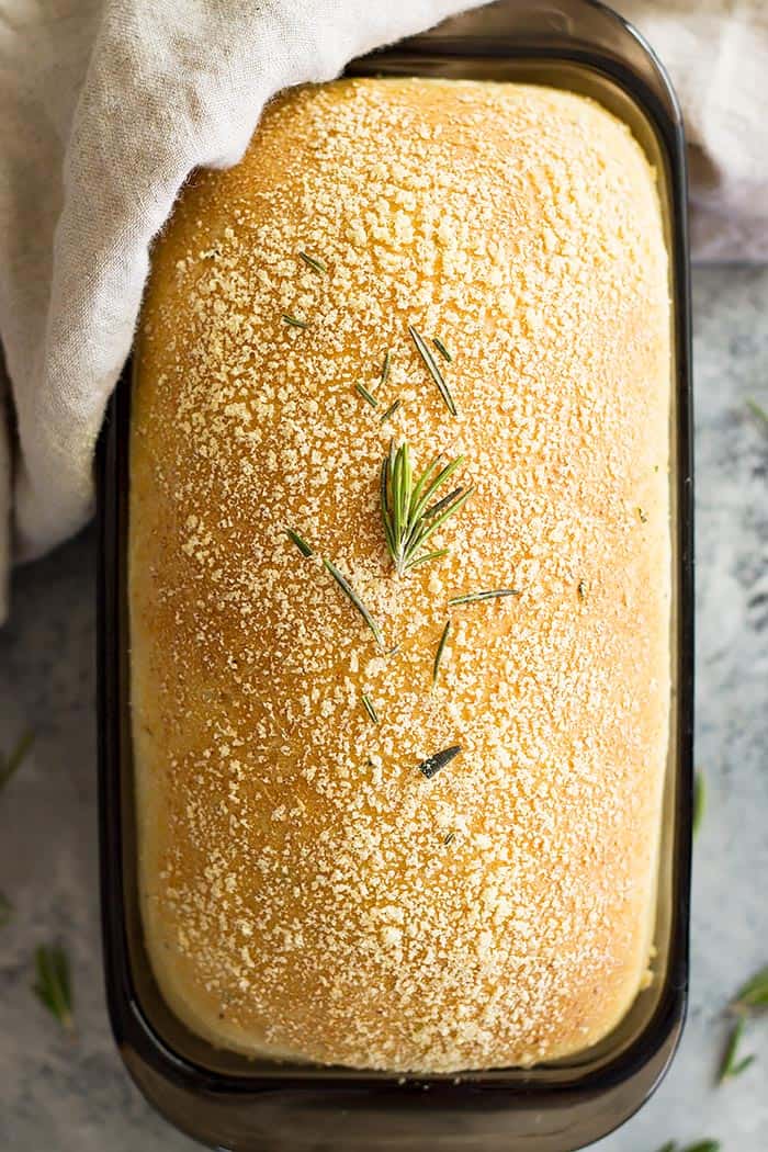 Top down view of a loaf of rosemary parmesan bread. 