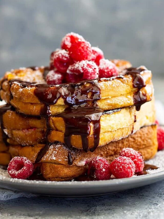 Raspberry Cheesecake Stuffed French Toast -is a very special brunch or breakfast! Buttery brioche bread stuffed with raspberry cheesecake filling then drizzled with hot fudge sauce! It's like dessert for breakfast!