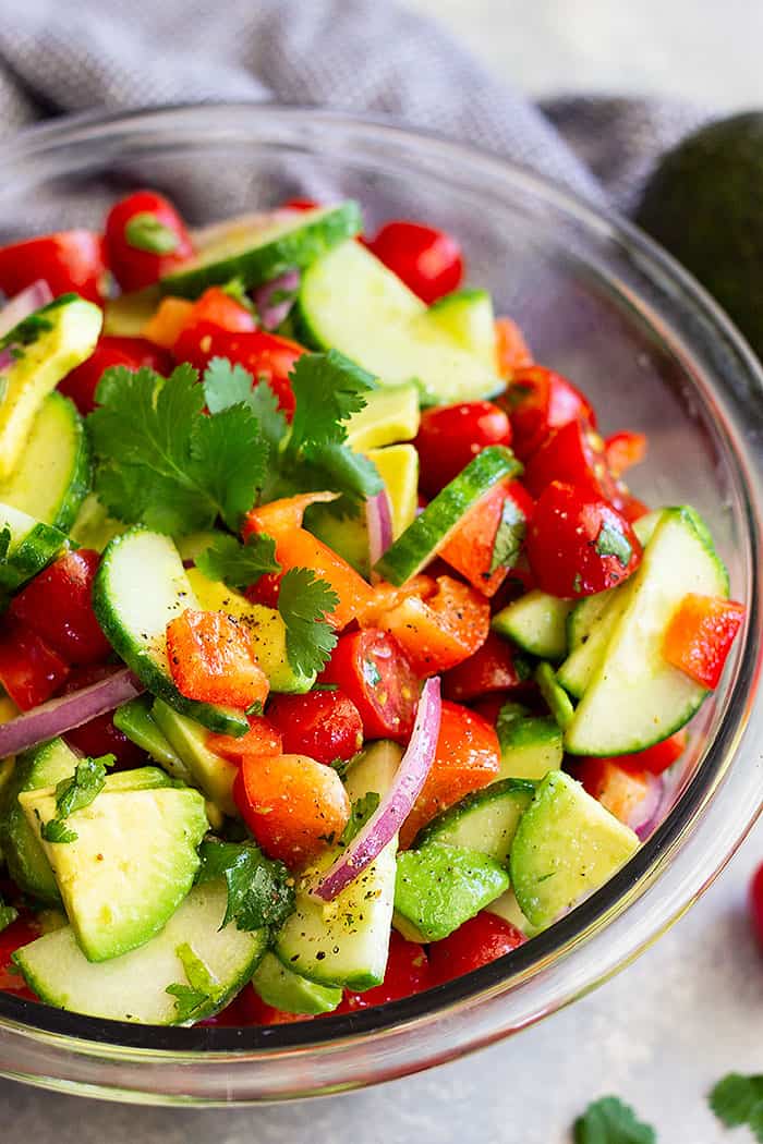 Tomato Cucumber and Avocado Salad -a quick, easy, and healthy salad that's great for summer! It's light, fresh, and full of flavor!