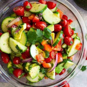 Tomato Cucumber and Avocado Salad -is an easy salad that's light, fresh, full of flavor, and perfect for summer! It's super quick to make and healthy to eat!