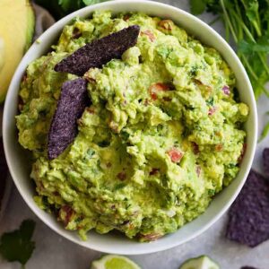 Homemade Guacamole Recipe -is a quick and easy recipe that's great for any party! It's healthy, great to dip chips or vegetables in, and it's great with any Mexican dish!