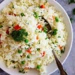 Easy Rice Pilaf with Carrots and Peas is a quick and easy side dish that pairs well with so many dishes! Great for casual weeknight dinners or for company.