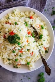 Easy Rice Pilaf with Carrots and Peas is a quick and easy side dish that pairs well with so many dishes! Great for casual weeknight dinners or for company.