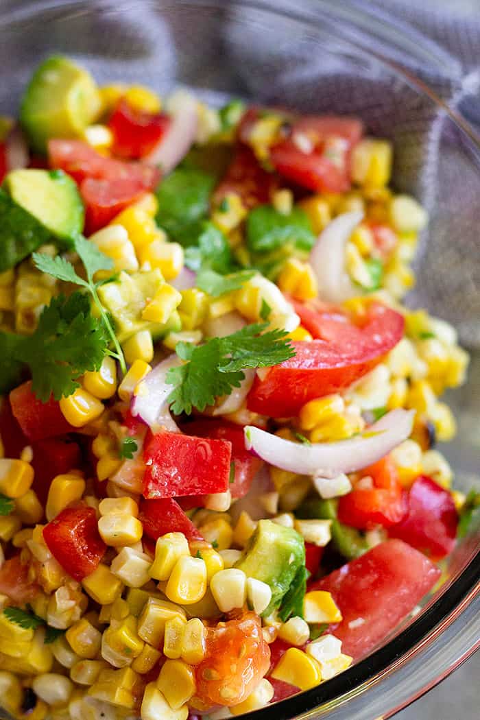 This Grilled Corn Salad with Tomato and Avocado is the perfect summer salad! It's light, healthy, easy to make, and can also make for a great lunch! #salad #summer #healthy #glutenfree
