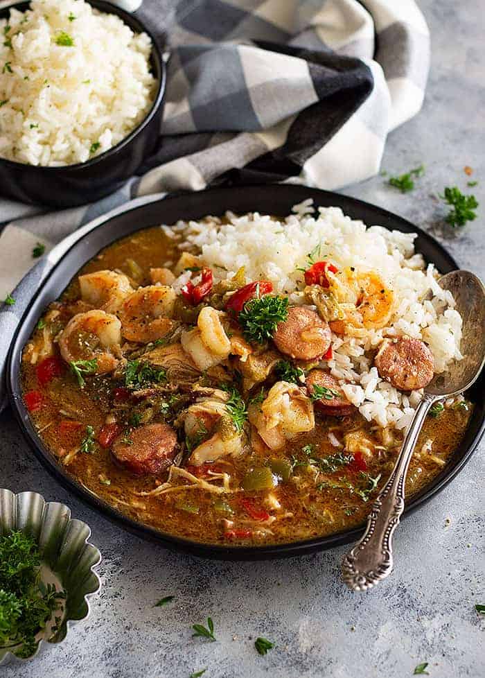 Slow Cooker Chicken, Sausage, and Shrimp Gumbo is a New Orleans inspired dish. Only it's made in the crockpot so you don't have to stand there watching it for hours! 