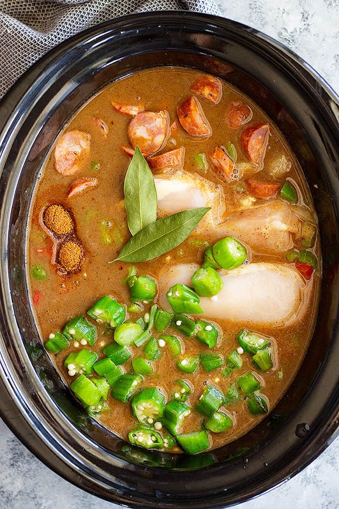 Slow Cooker Chicken, Sausage, and Shrimp gumbo is a wonderfully flavorful and filling meal. This New Orleans inspired dish is made easy with the help of the crockpot!
