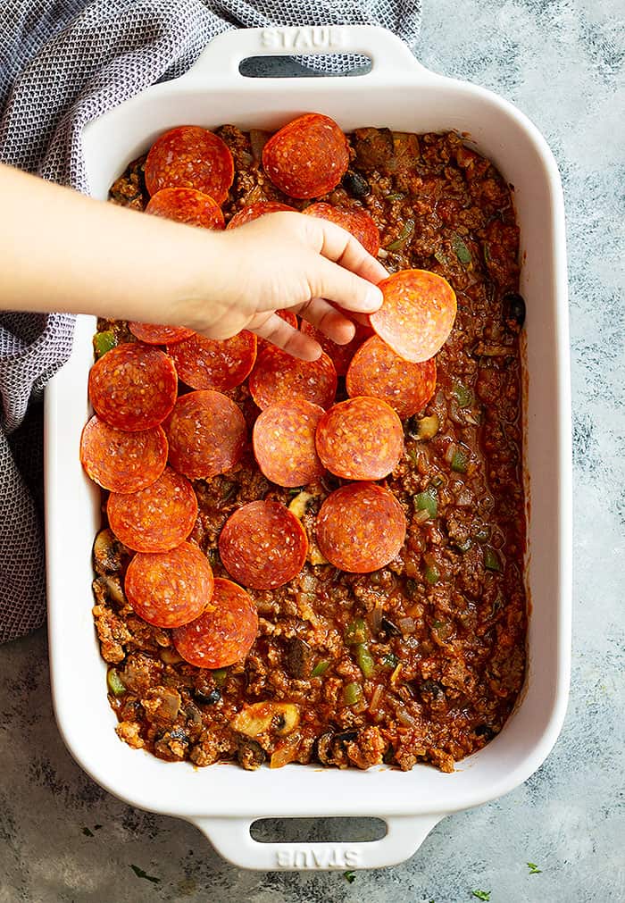 This Upside Down Pizza Casserole is a great weeknight meal that will please the whole family! It's easy to make and the perfect comfort food! #easyrecipe #casserole #pizza