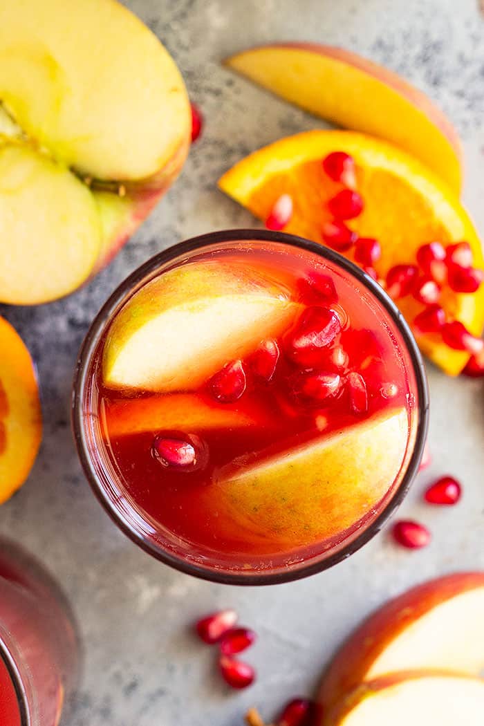 This Pomegranate Apple Cider Sangria is the perfect fall or winter drink! It's even special enough for the holidays! Easy to make non alcoholic too! #drinks #cocktail #Christmascocktail #fallcocktail