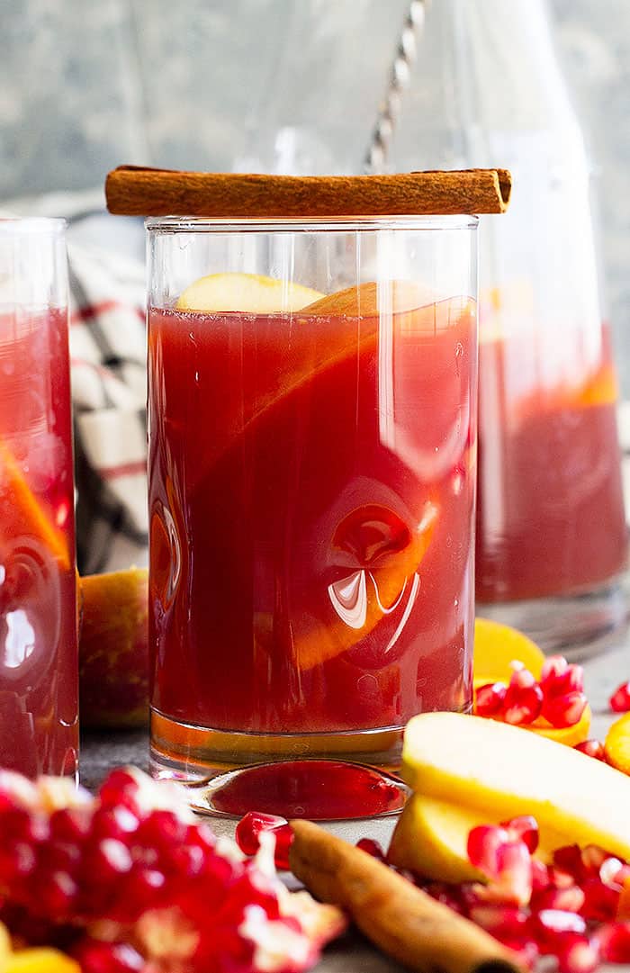 This Pomegranate Apple Cider Sangria will delight at your next get together! Perfect for Thanksgiving and Christmas and it's easy to make non alcoholic too! #drinks #cocktail #Christmascocktail #fallcocktail