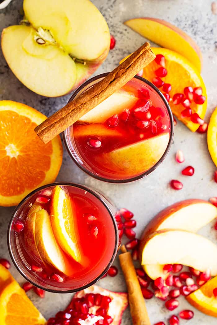 This Pomegranate Apple Cider Sangria will delight at your next get together! Perfect for Thanksgiving and Christmas and it's easy to make non alcoholic too! #drinks #cocktail #Christmascocktail #fallcocktail