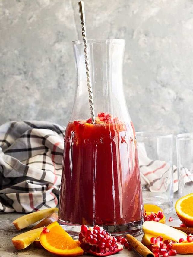 This Pomegranate Apple Cider Sangria is the perfect fall or winter drink! It's even special enough for the holidays! Easy to make non alcoholic too! #drinks #cocktail #Christmascocktail #fallcocktail