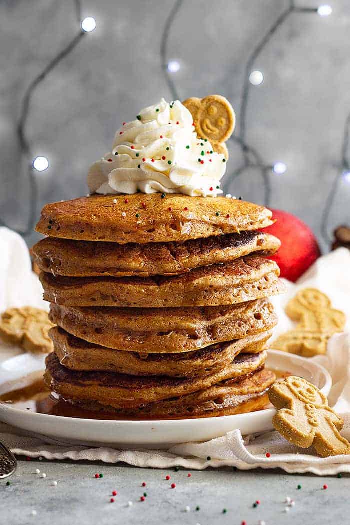These soft and fluffy Gingerbread Pancakes are spiced just right and taste like a gingerbread cookie!! These will make the perfect Christmas morning breakfast!! #gingerbreadpanckes #christmasmorningbreakfast