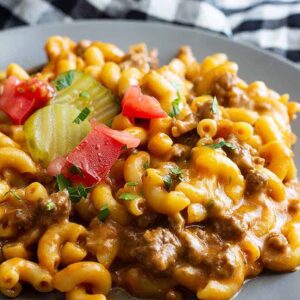 This Hamburger Helper Cheeseburger Pasta Skillet takes under 30 minutes to make and tastes way better than the store bought stuff! Plus, it's made with real ingredients! #pastaskillet #groundbeef