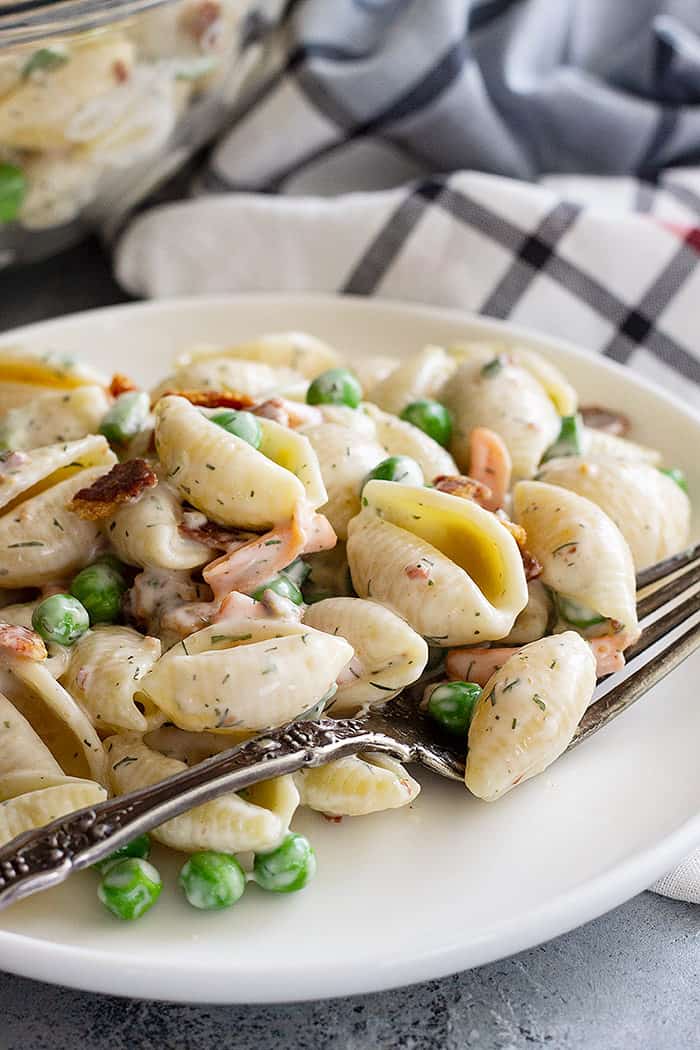 Bacon Ranch Pasta Salad served on a plate with a fork. 