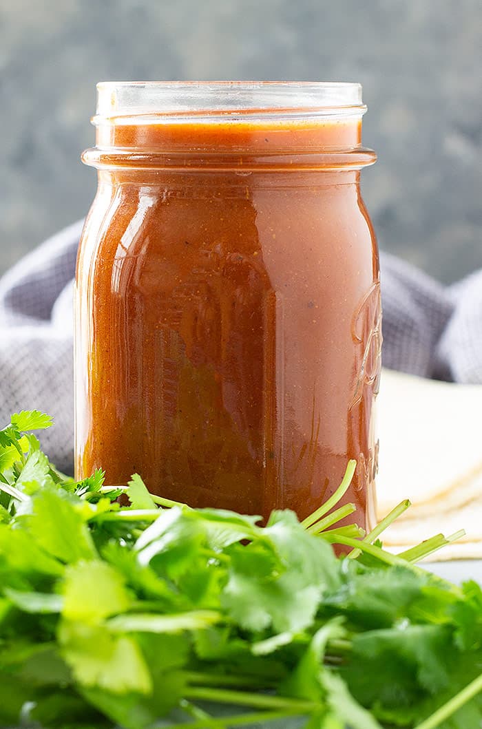 A jar of homemade enchilada sauce.