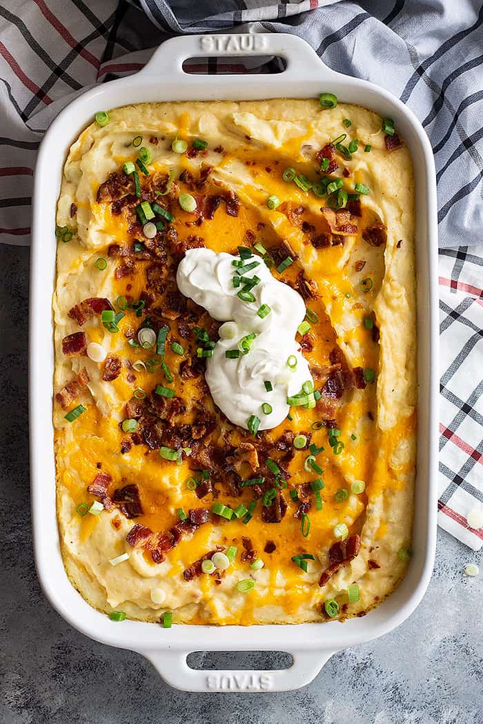 casserole dish filled with loaded mashed potatoes