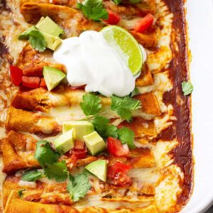 These Cheese Enchiladas are corn tortillas filled with monterey jack cheese and topped with a homemade red enchilada sauce! They are easy to make and will become a family favorite! #redenchiladas #cheeseenchiladas