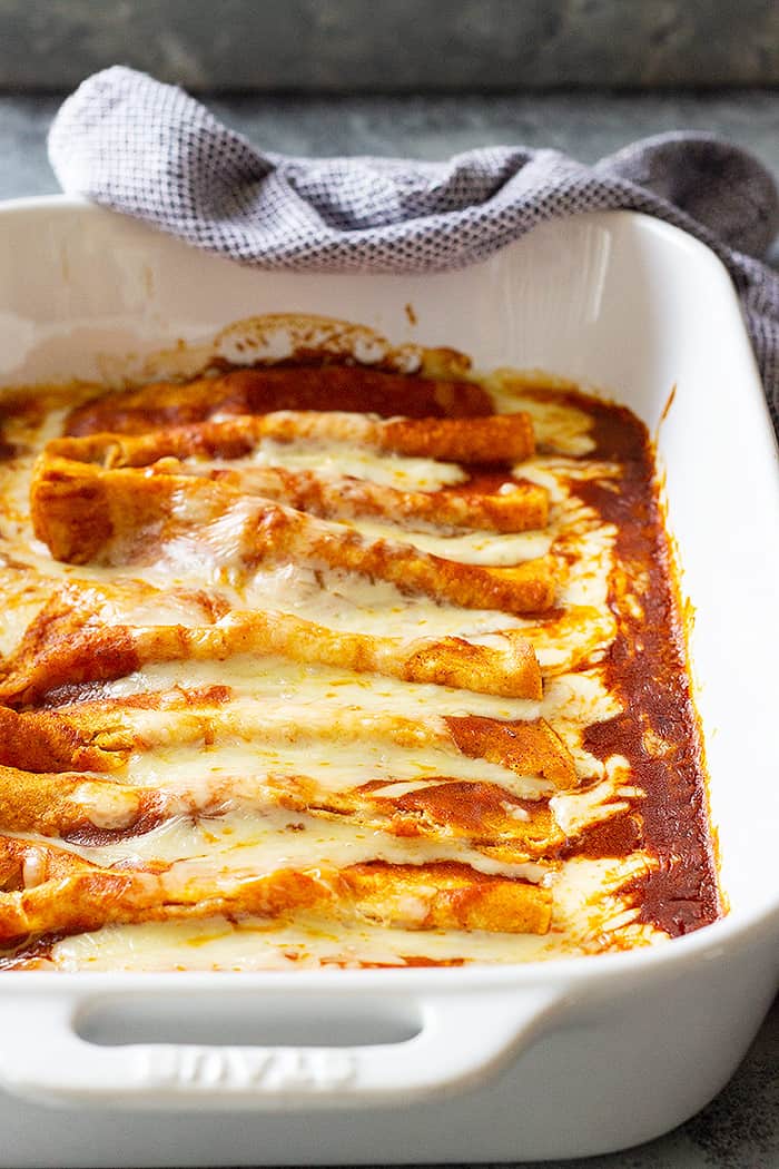 A large pan of cheese enchiladas filled with melted cheese!