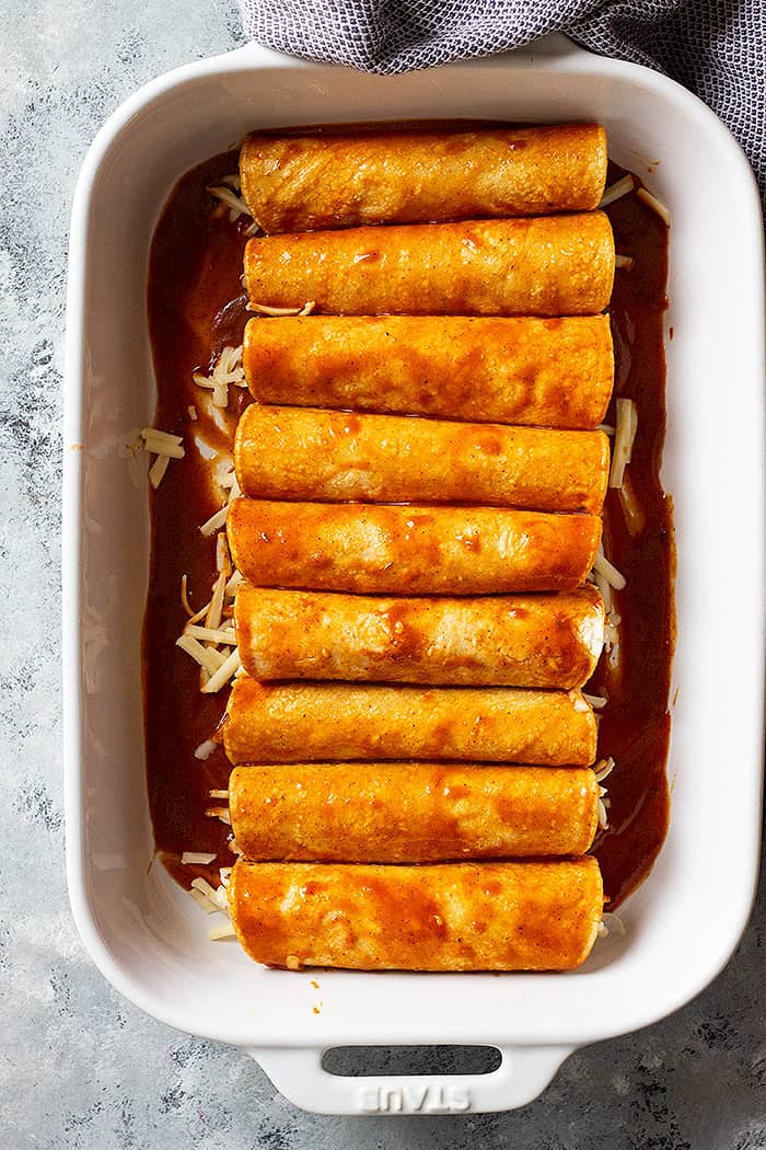 Top down view of cheese enchiladas ready to be baked. 