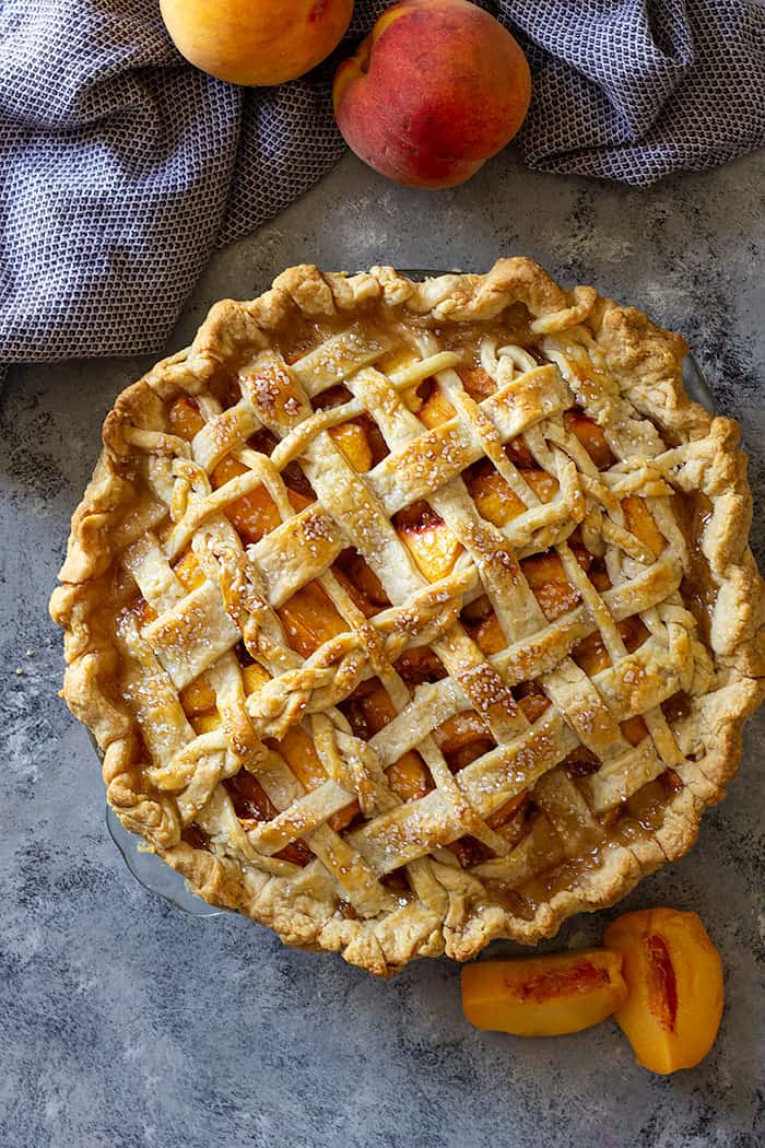 Freshly baked peach pie with an all butter pie crust. 