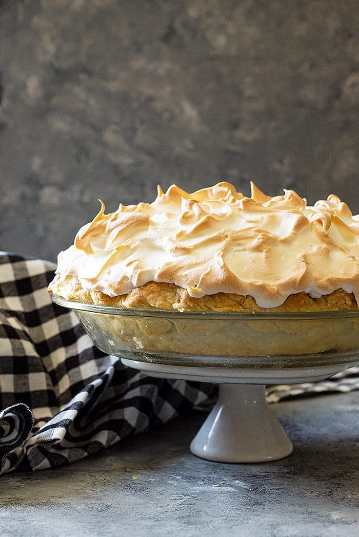 Chocolate Meringue pie on a stand.