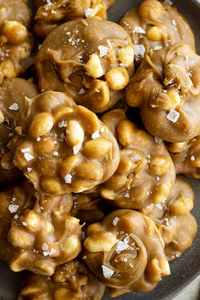 Close up of easy peanut pralines sprinkled with flaky sea salt. 