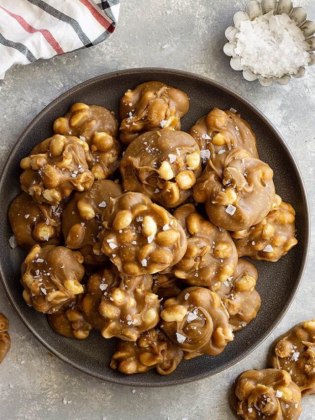 Top down view of easy peanut pralines on a plate and flaky sea salt scattered.