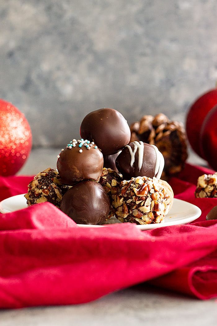 Homemade Chocolate Truffles stacked on top of each other.