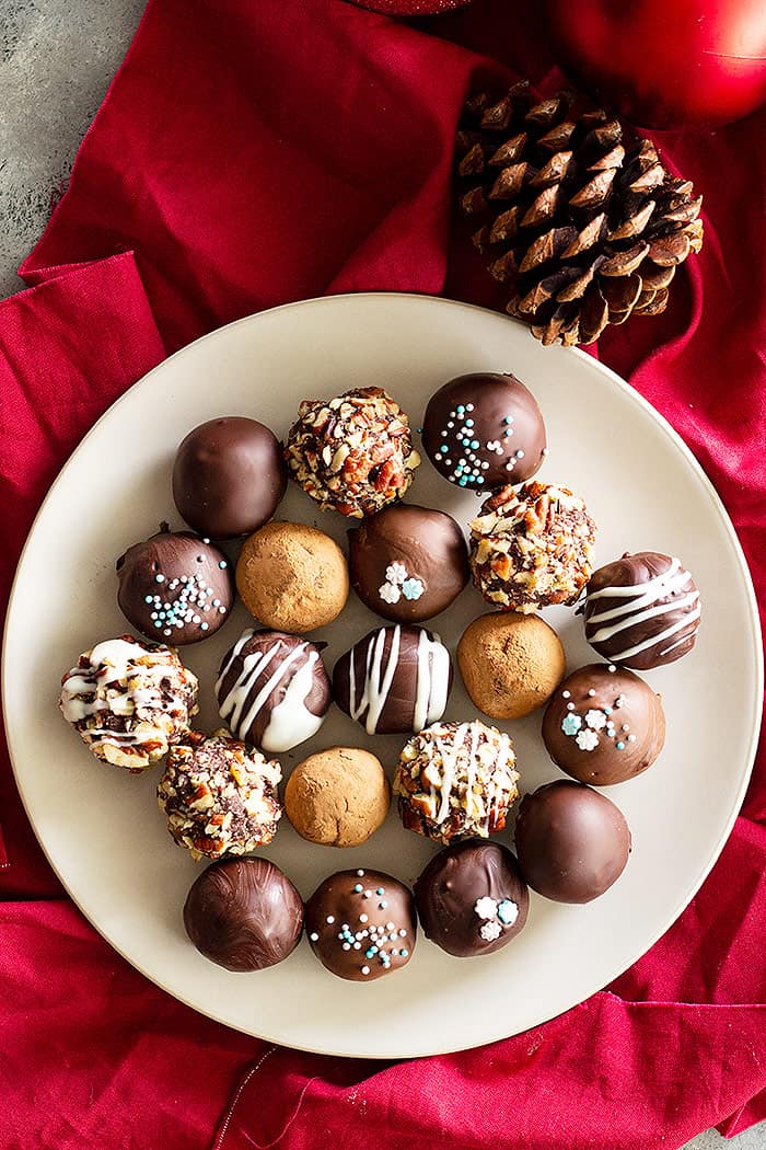 Top down view of a plate of chocolate truffles.