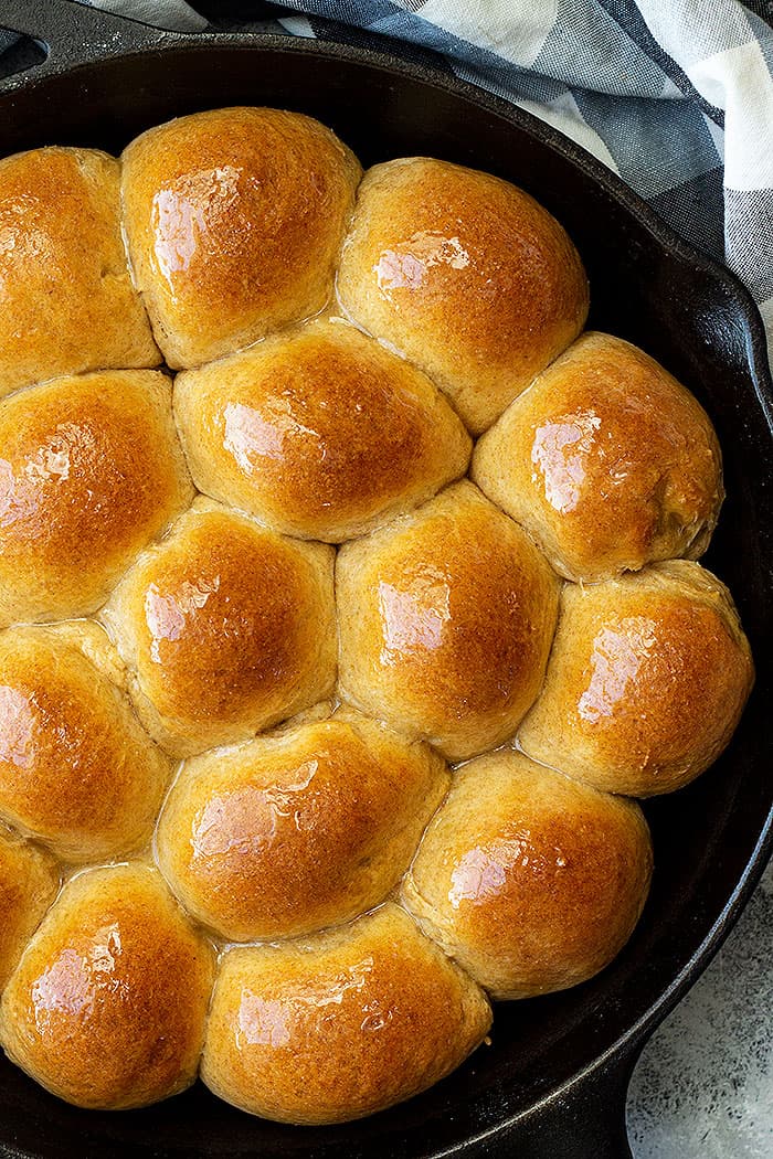 A pan of honey wheat rolls fresh from the oven.