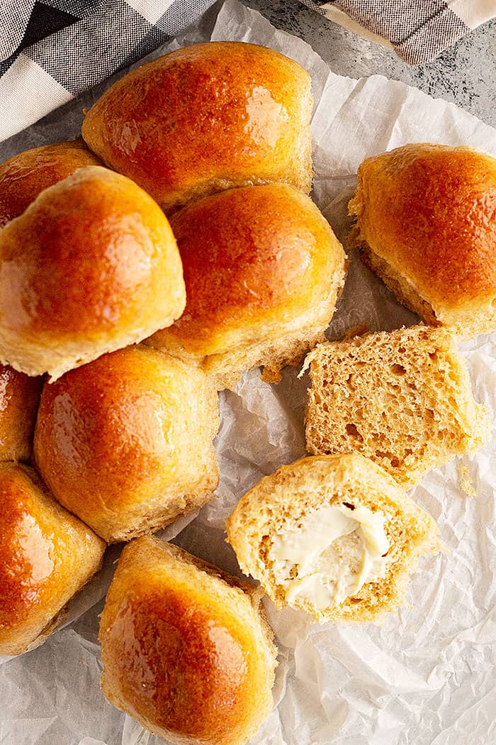 Top down view of honey wheat dinner rolls.