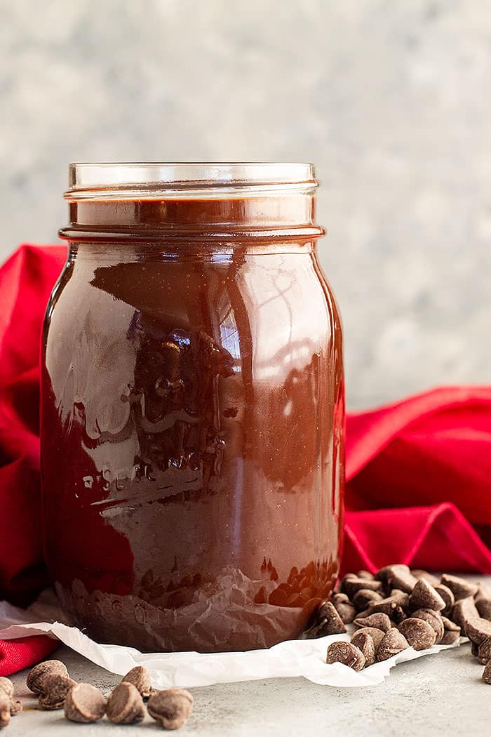 A jar of homemade hot fudge sauce. 