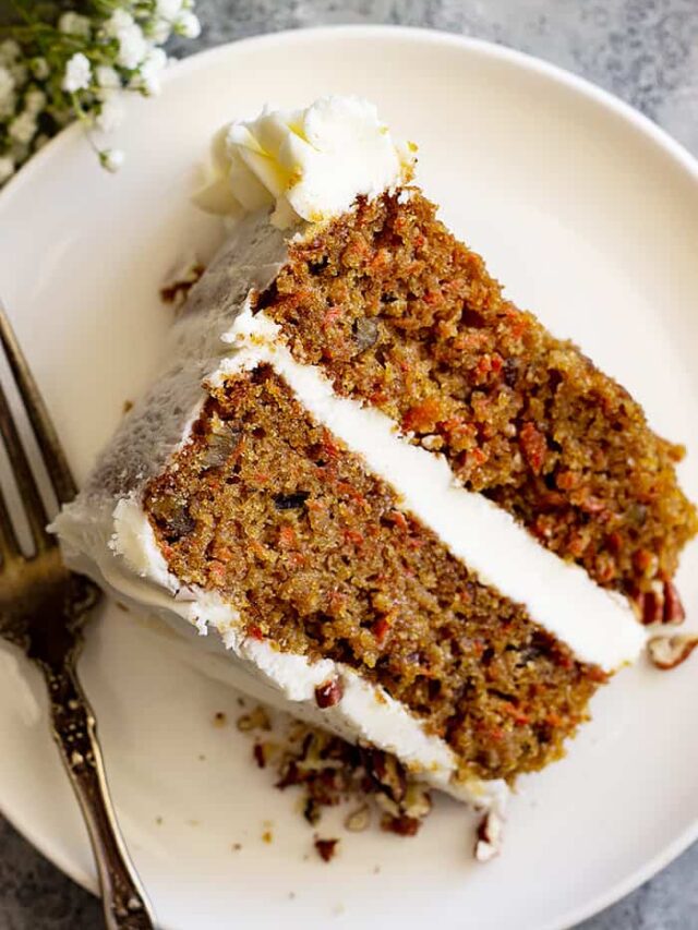 Top down view of slice of carrot cake on a white plate.