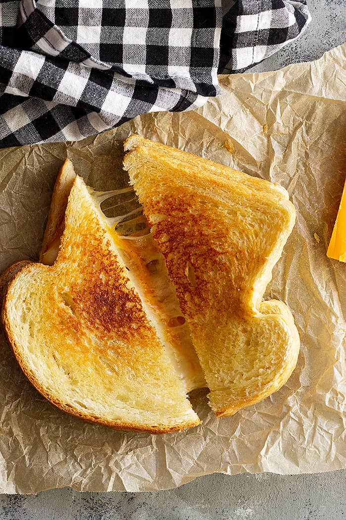 A toasty melty gooey grilled cheese sandwich.