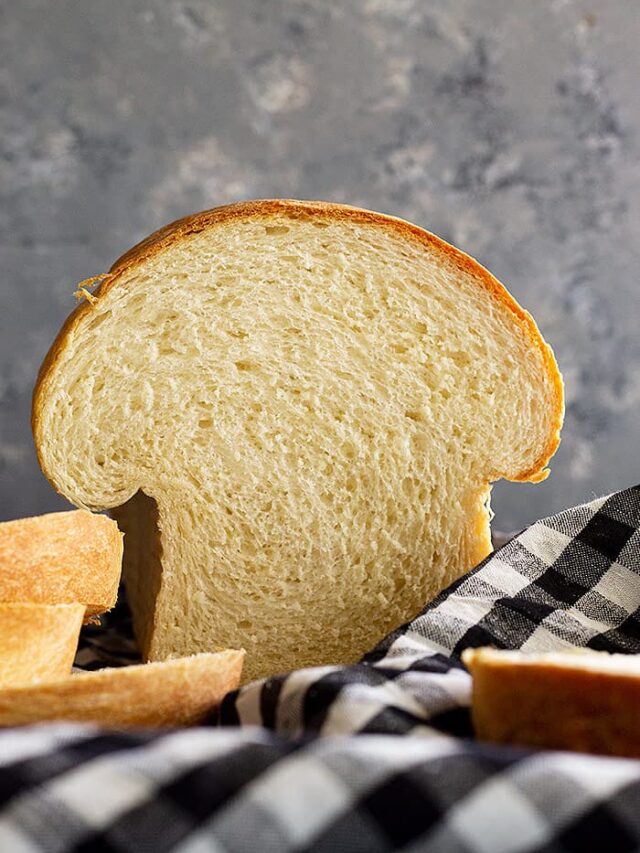 Loaf of bread that has been sliced into.