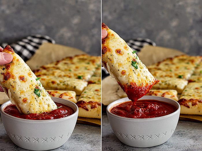 Dunking a breadstick into pizza sauce. 