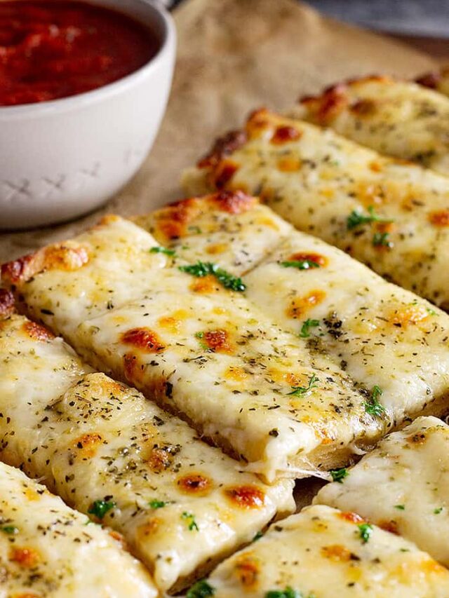 Close up of cheese breadsticks.