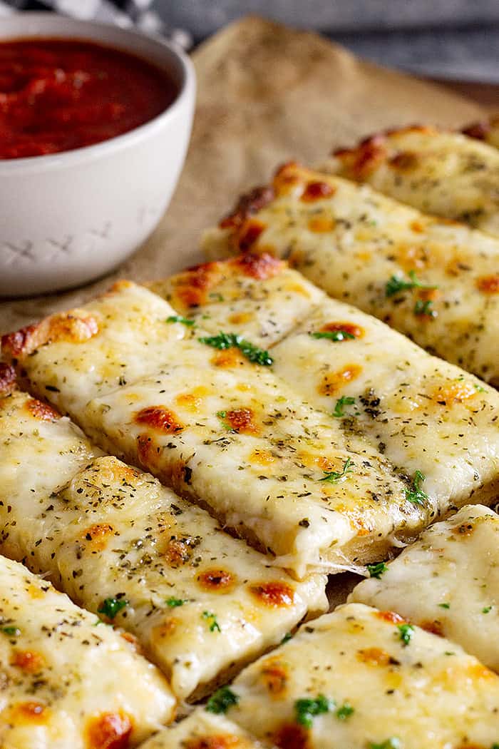 Close up of cheese breadsticks.