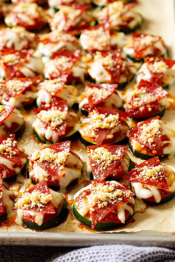 Close up of pizza bites on a baking sheet fresh from the oven.