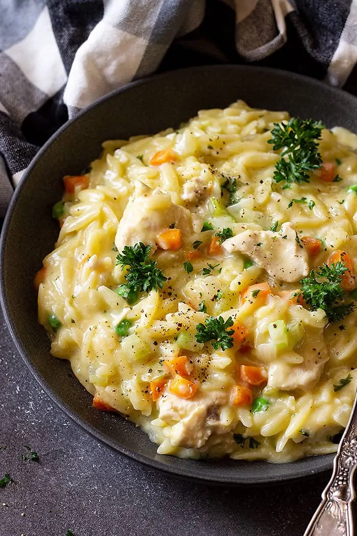 Finished orzo dish served in a bowl.